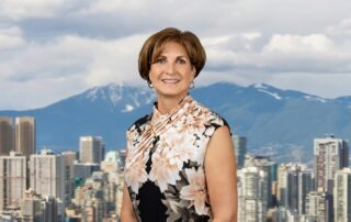 Cindy Trytten smiling against a city skyline.