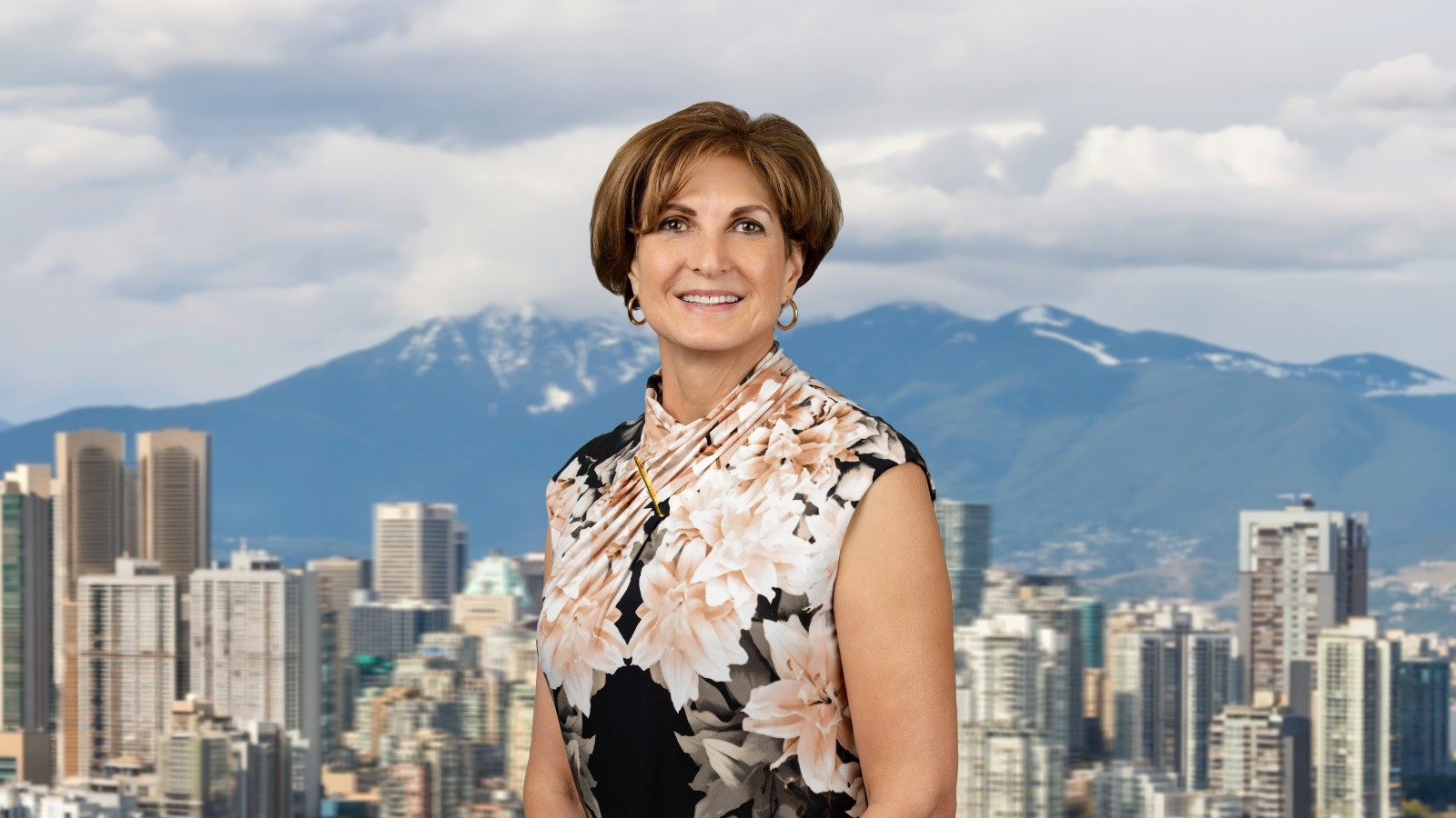 Cindy Trytten smiling against a city skyline.